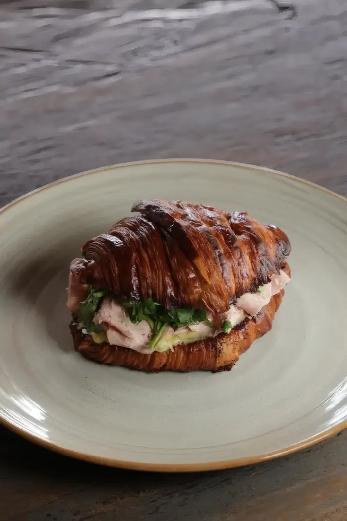 A croissant with mortadella, parmesan and green leaves, Shaffa GastroBazar, Balangan, Bukit