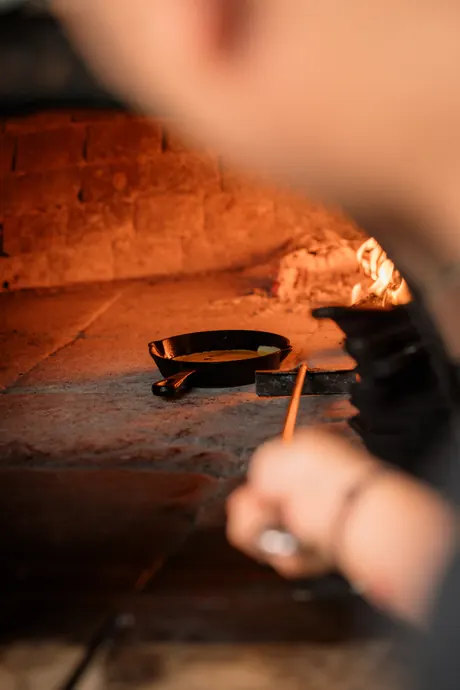A pan going into the wood-fired oven, Shaffa GastroBazar, Balangan, Bukit