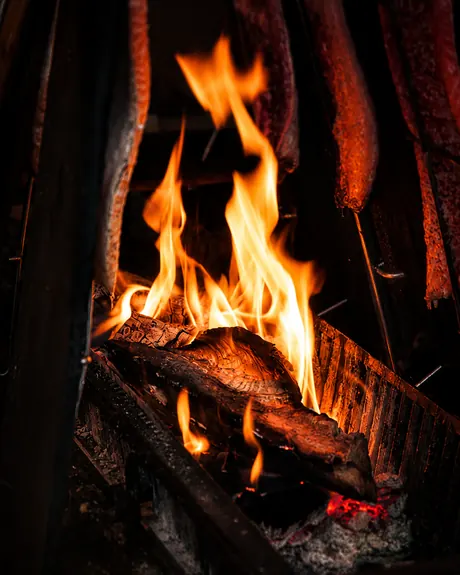 Fire under fish in the hot smoker, Shaffa GastroBazar, Balangan, Bukit