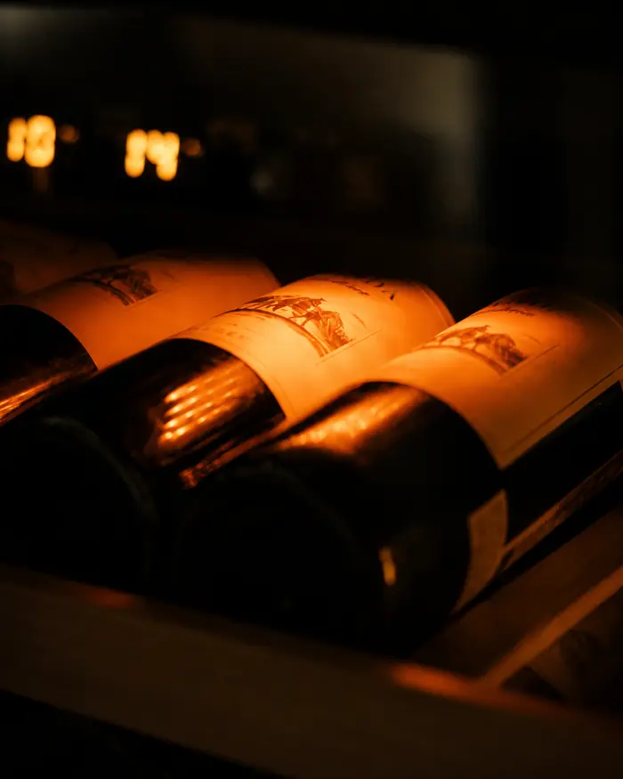 Wine bottles in the warm light of the rack, Shaffa GastroBazar, Balangan, Bukit